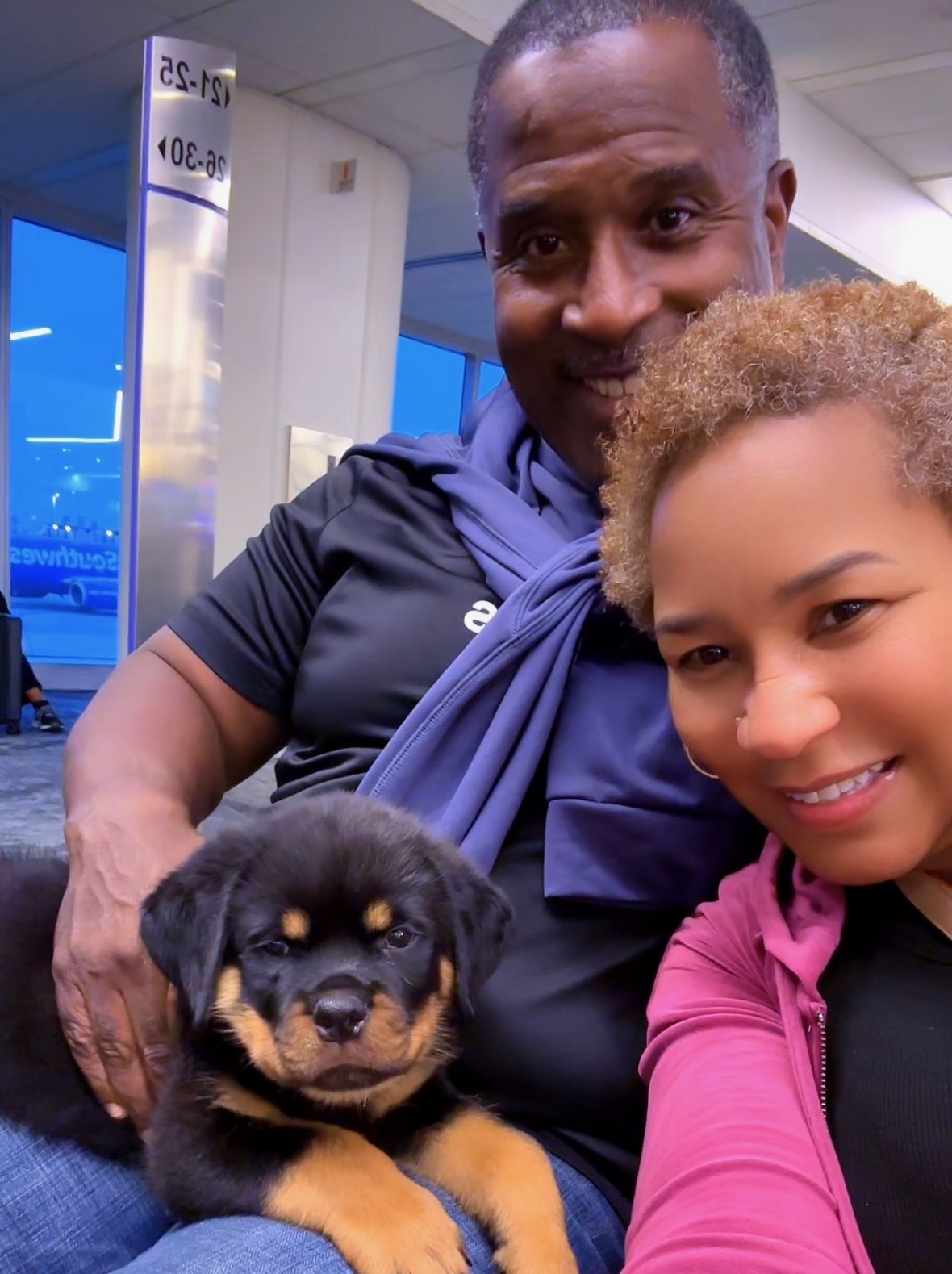 Ms. Pam and her husband with Blaze at the airport, picking up their VomBandaHause puppy in California